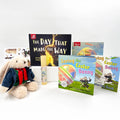 Children's books and a plush toy on a white background